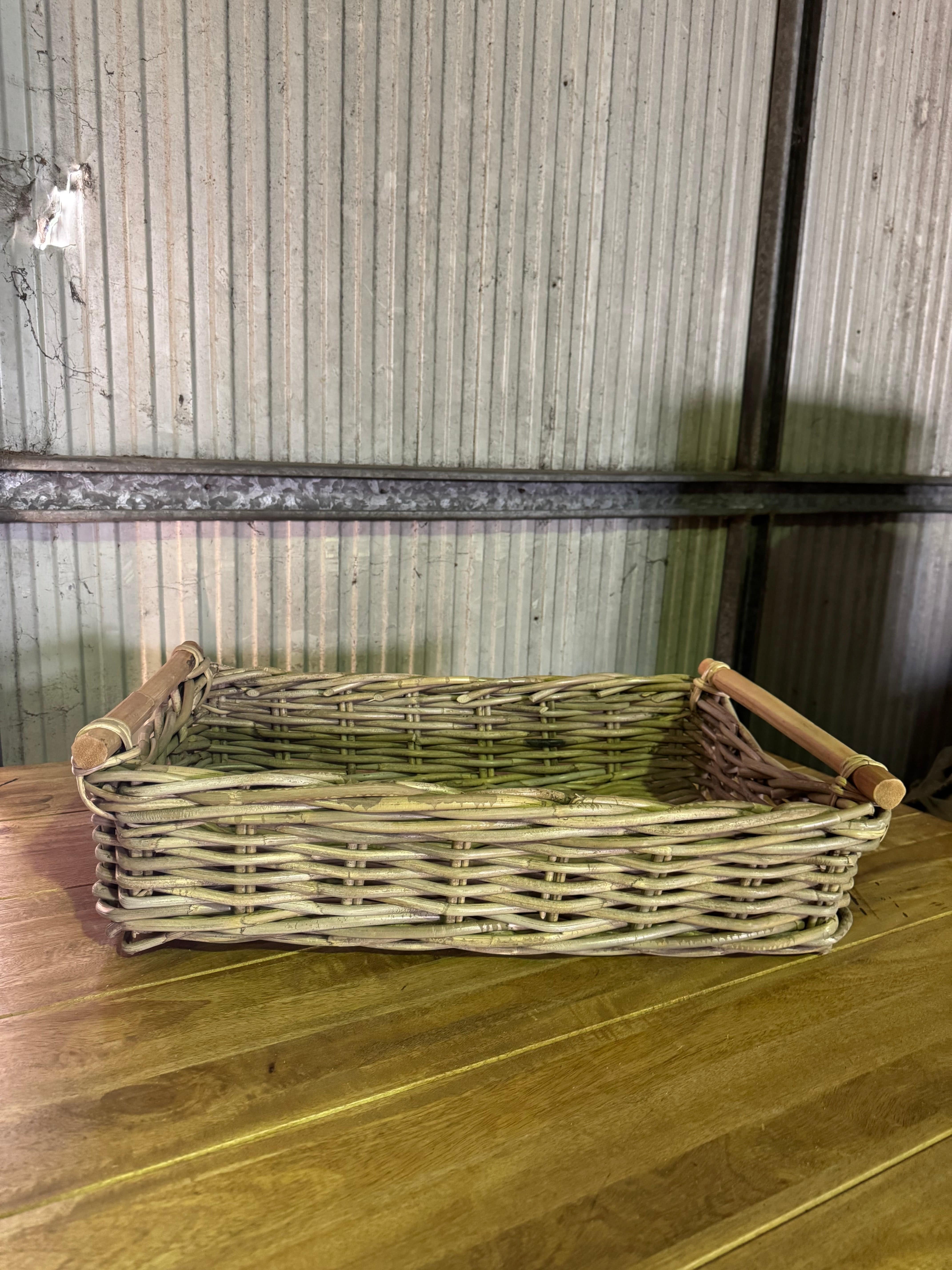 Side view of Kubu Rect Tray with rustic woven design and sturdy wooden handles, perfect for decorative storage use.