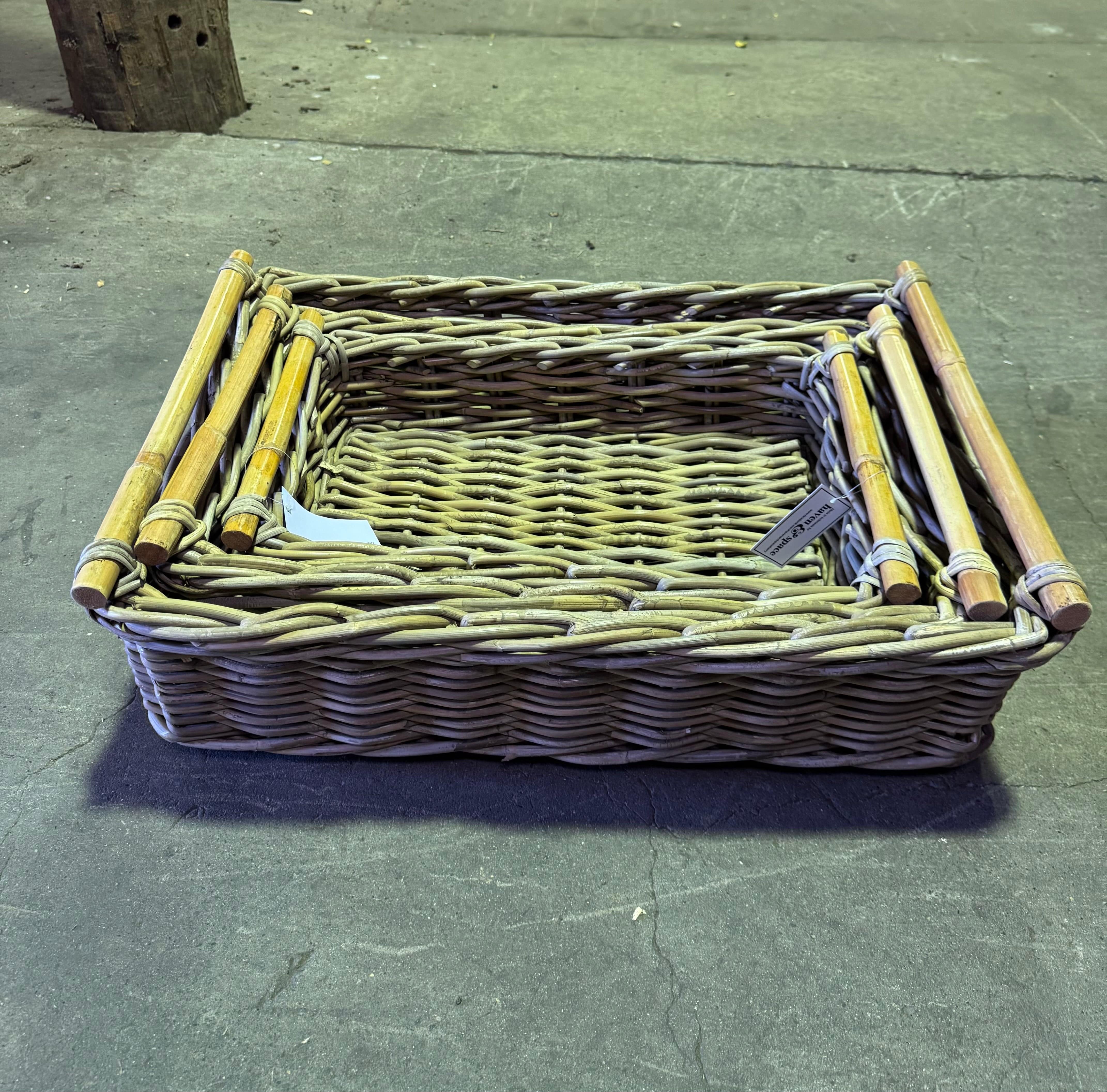 Stacked Kubu Rect Trays in natural rattan with wooden handles, ideal for stylish storage and home decor organization.