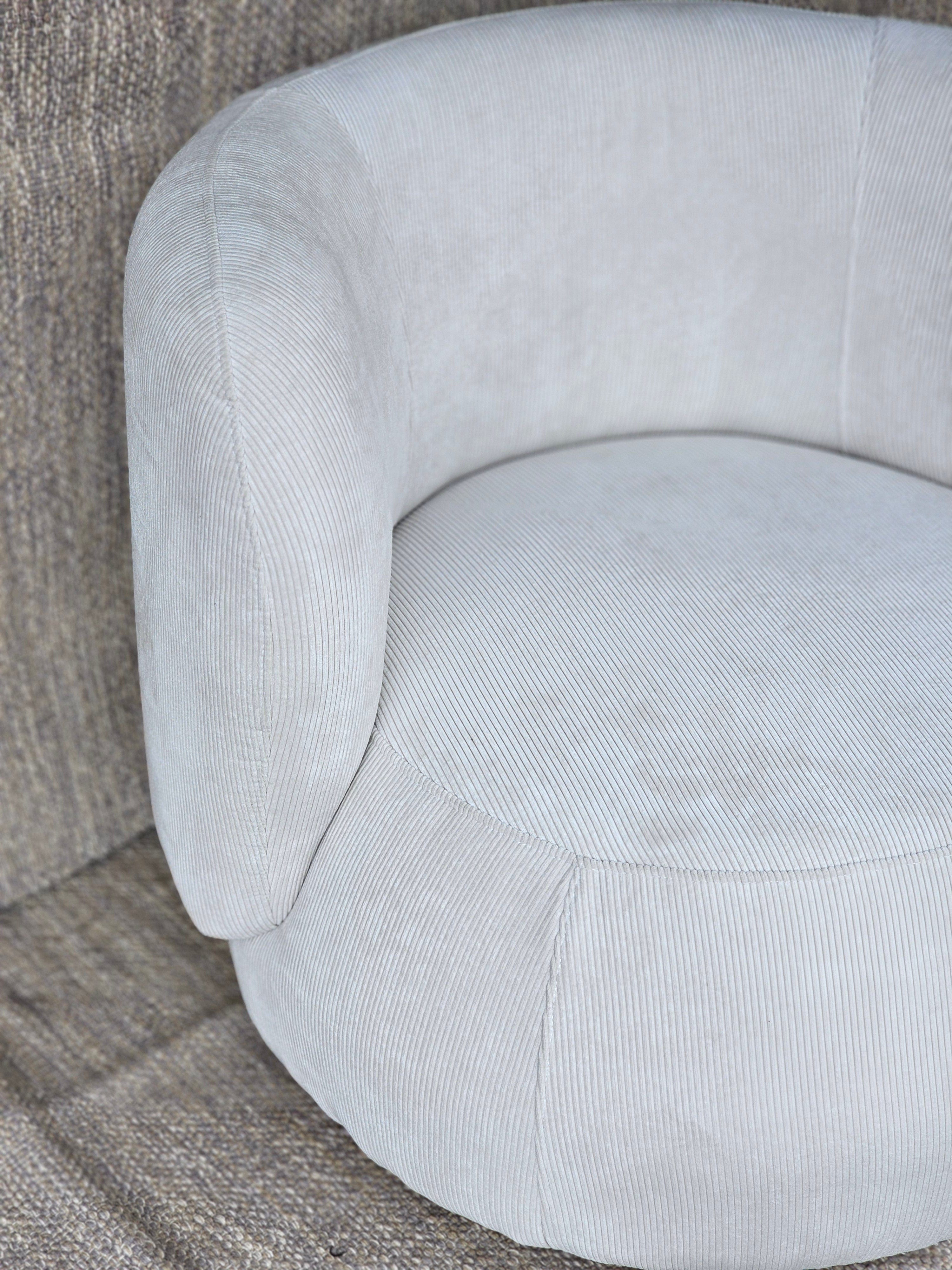 Top view of Luna Swivel Armchair highlighting circular seat and curved backrest, designed for comfort and modern home decor.