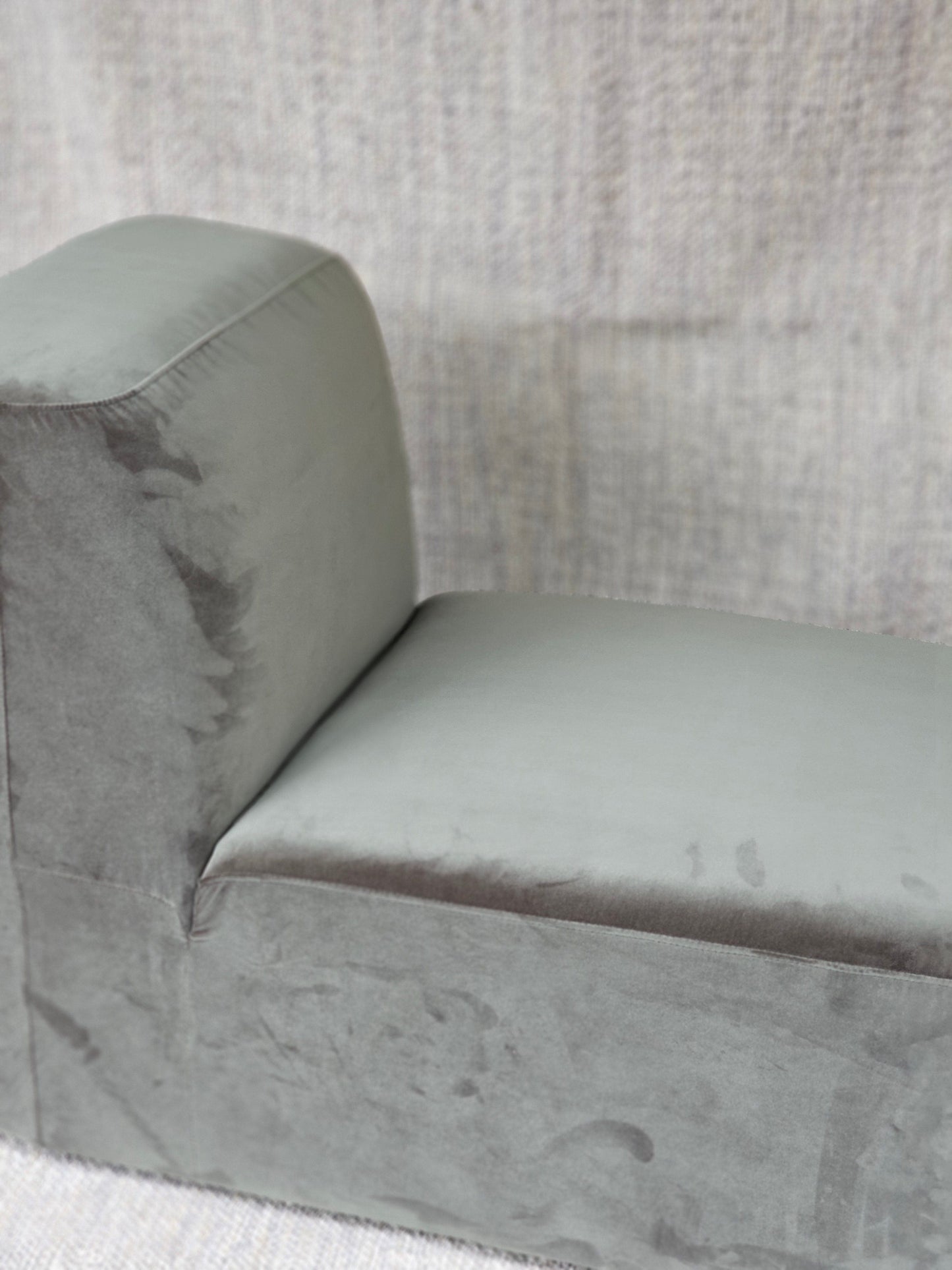 Modern Omega Upholstered Armchair with grey velvet finish and clean lines, perfect for contemporary home decor.